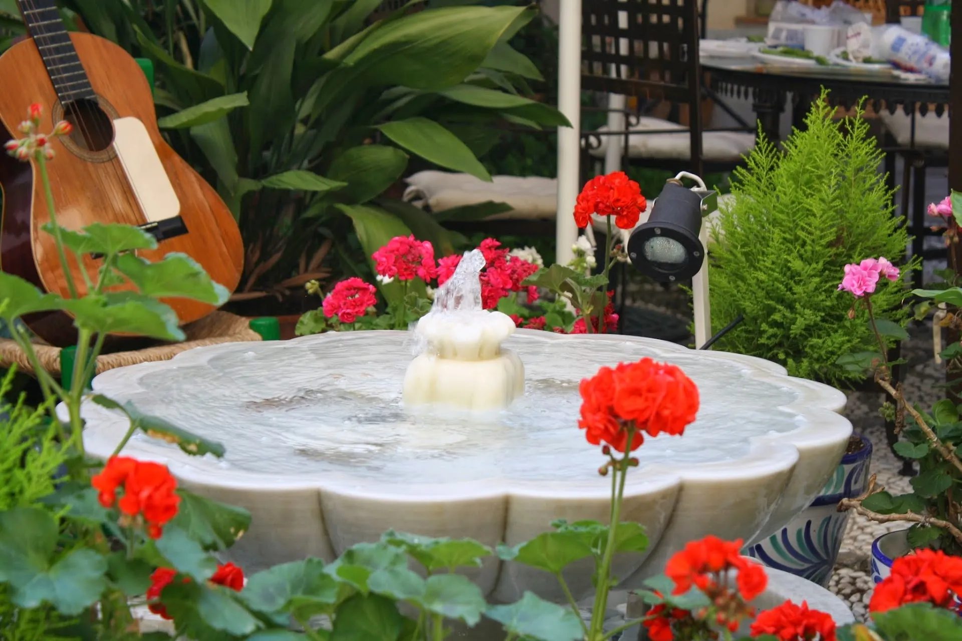 Fountain, flowers and a Spanish guitar